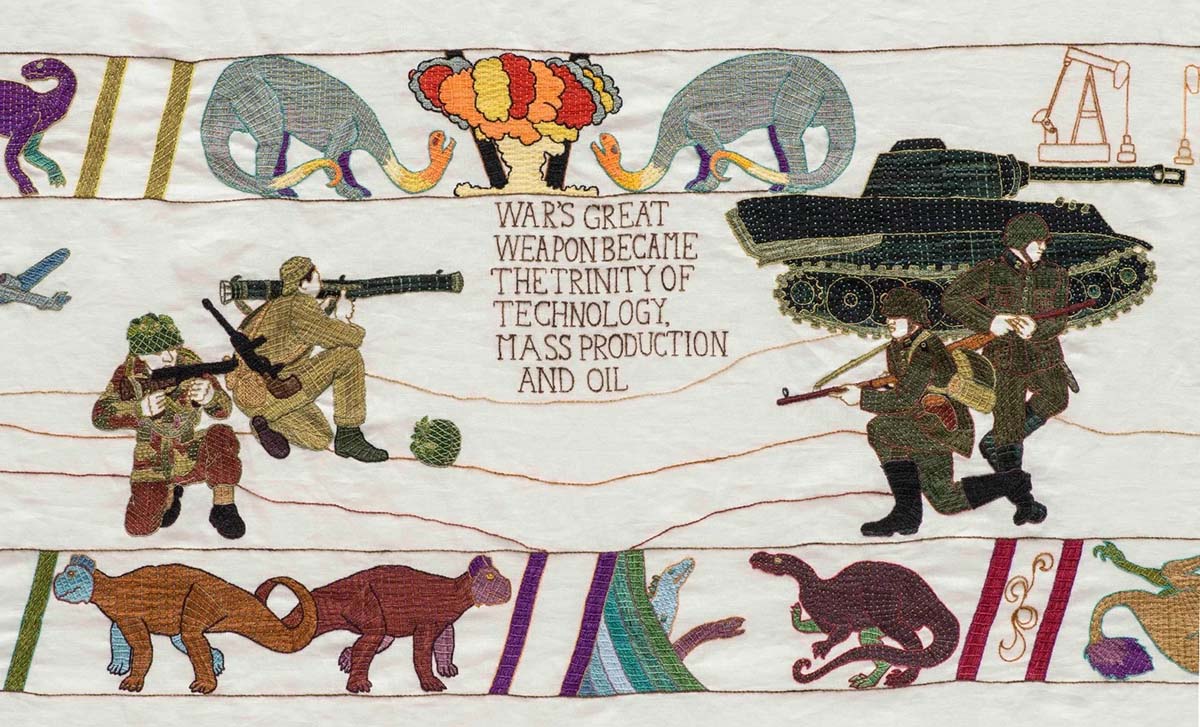 A close up of the portion of the tapestry showing nuclear energy and WWII