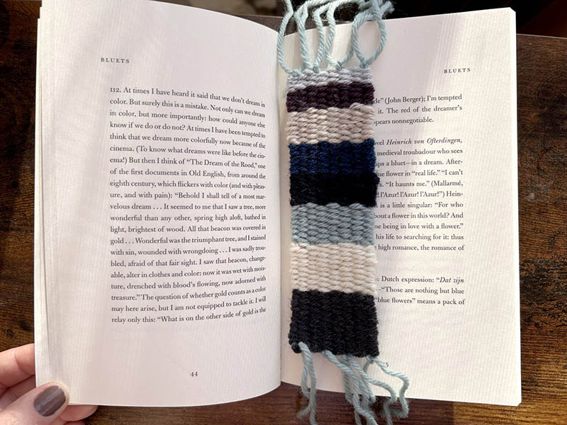 A woven bookmark in a book