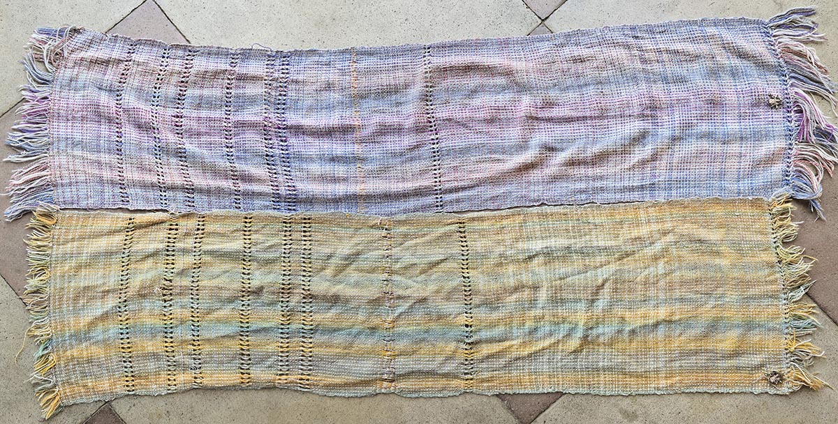 A purple-gray and a brown-green-gray rigid heddle woven scarf