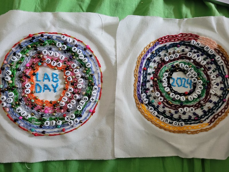 Two circular embroideries with lots of beads