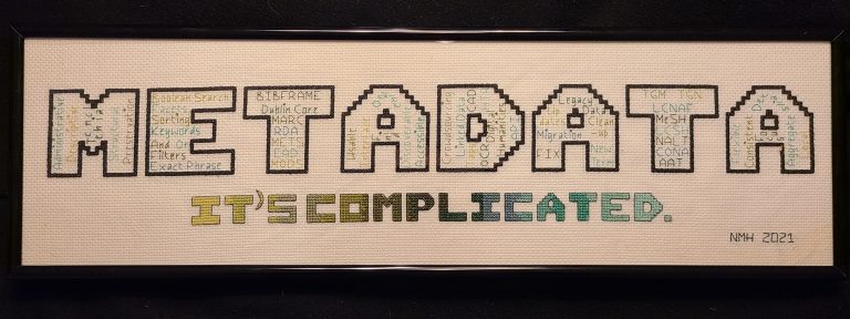 An embroidery that says METADATA in big letters and "it's complicated" in a rainbow below. Each letter of METADATA has more things in it.