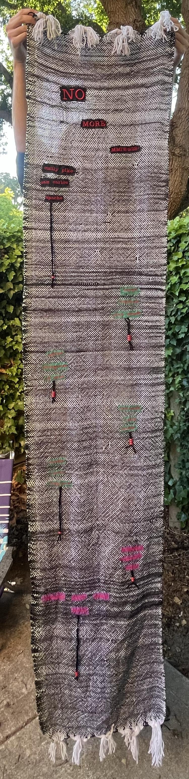 The full length of the weaving / embroidery