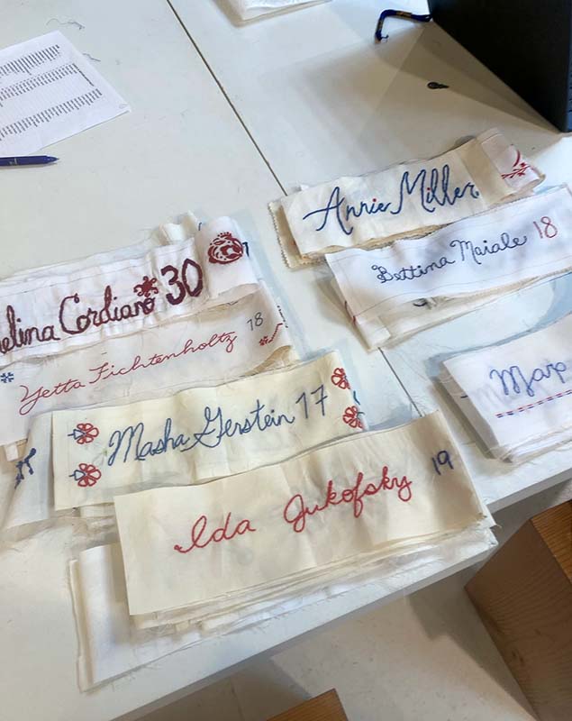 An in-progress image of the banner with more names and a spreadsheet in the background