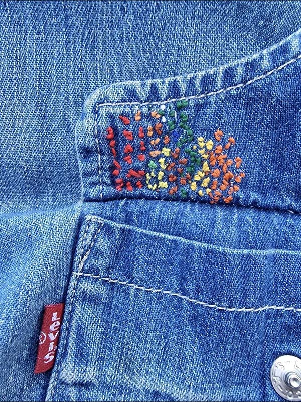 Jeans embroidered with colorful French knots